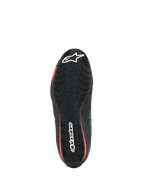 Alpinestars Celer sko, motorcykelsko, sort og klar rød, set nedefra, viser den teksturerede gummisål med hvidt Alpinestars-logo og røde detaljer.