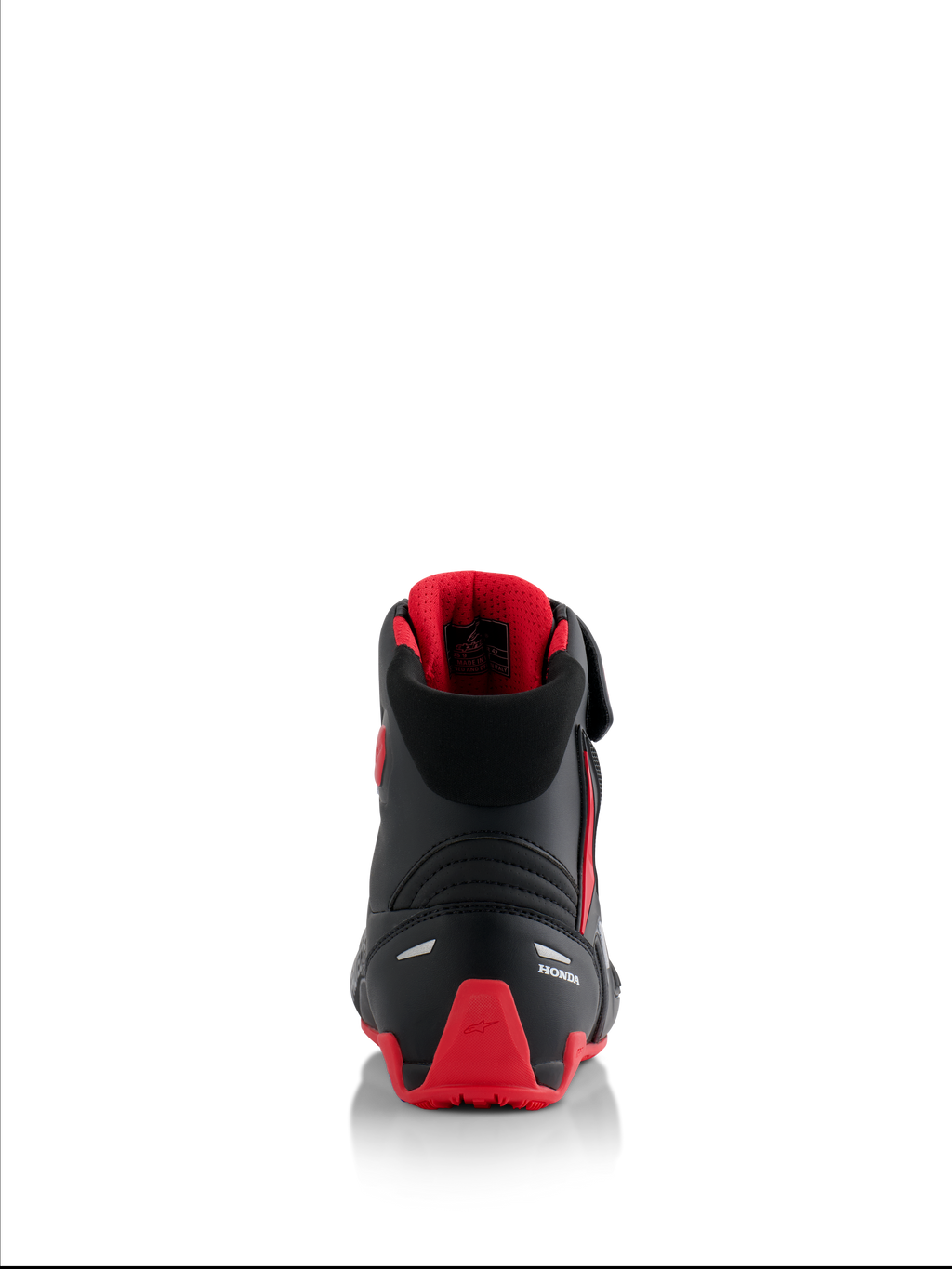 Alpinestars Honda Faster-4 sko, motorcykelsko, sort og rød, set bagfra med hvidt Honda-logo og rød TPU-hælkappe, polstret krave med rødt mesh-for, refleksdetaljer for sikkerhed