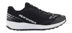 Alpinestars Meta Road V2 sko, sort atletisk fodtøj med en tyk hvid sål, hvidt Alpinestars-branding og stjernelogo, tekstureret mesh-overdel, sorte snørebånd og robust ydersål med greb, letvægts sportsligt design til raceteam-arbejdstøj og hverdagsbrug