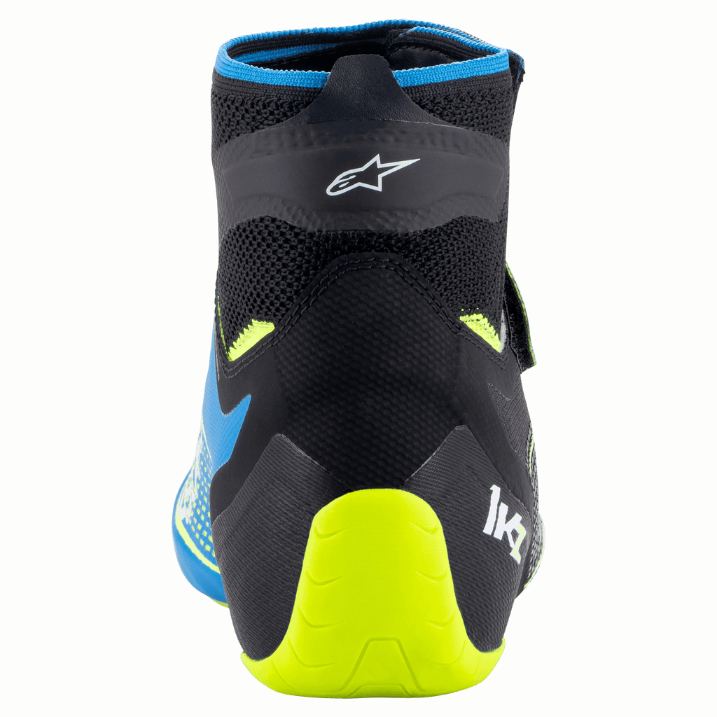 Alpinestars Tech-1 KZ V2 sko, karting-sko, sort, emaljeblå og neon-gul, set bagfra, der viser den strikkede overkonstruktion, Alpinestars-logo og den klare neon-gule hælstøtte