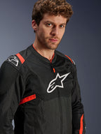 Alpinestars T-Sps Air V2 Jacket, Black with Red Fluo accents, Textile Mesh Motorcycle Jacket, worn by model, featuring white Alpinestars logo on chest and shoulders, breathable mesh panels, sporty urban riding style