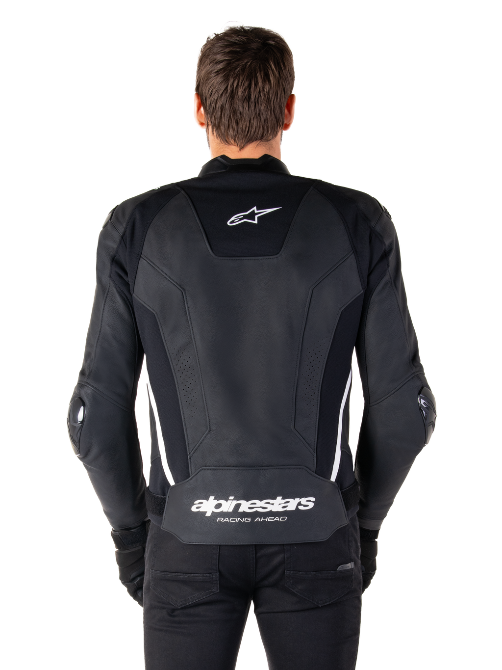 Bagsiden af Alpinestars Missile V3 læderjakken i sort og hvid, med Alpinestars stjernelogo på den øverste del af ryggen og branding på lænden, hvide lodrette striber og udvendige albue-sliders, premium racing sportslæderjakke.