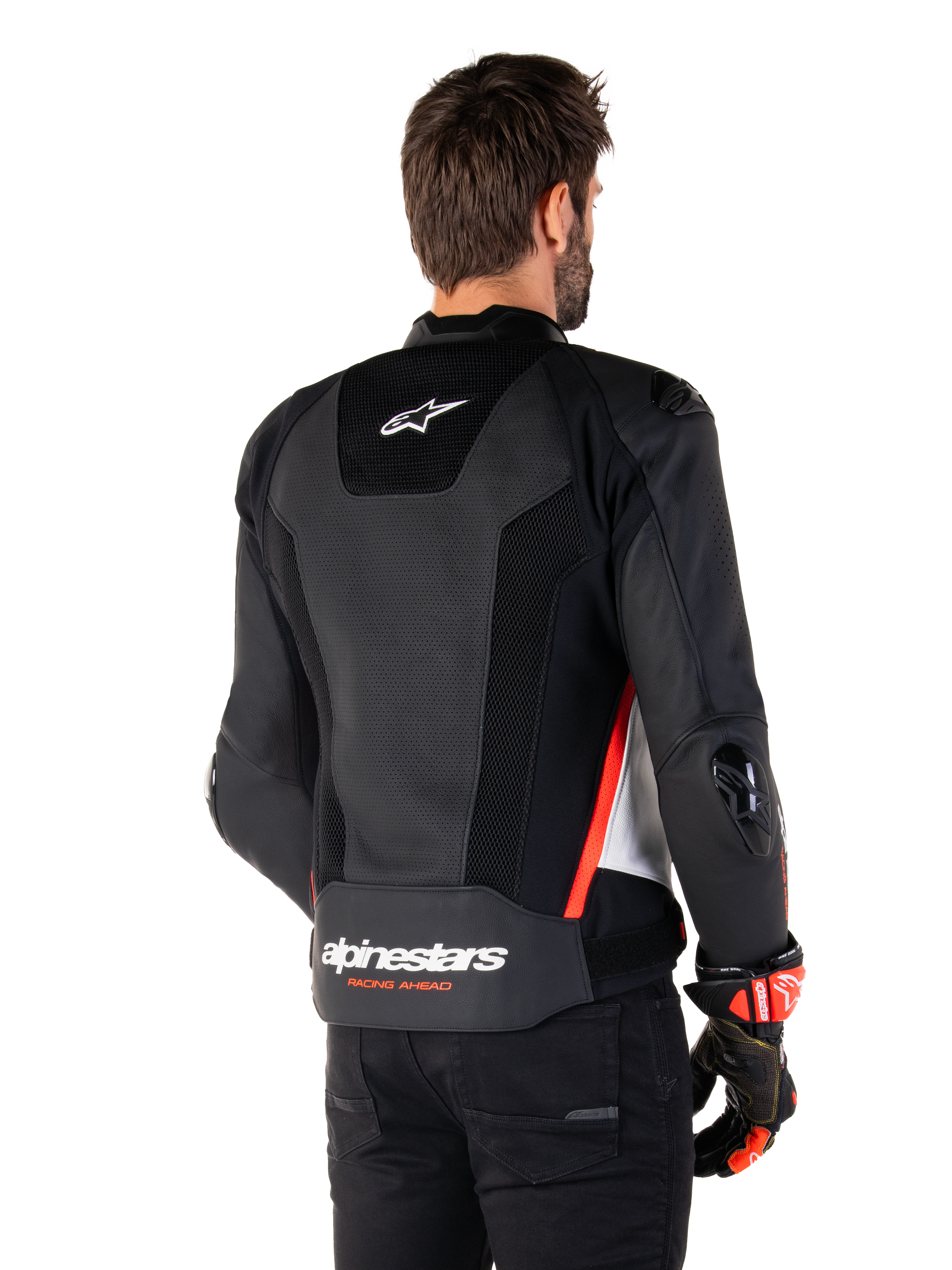 Alpinestars Missile V3 Airflow læderjakke, set bagfra, sort, hvid og rød fluo, med omfattende perforeringer for køling, udvendige DFS-skydere på skuldre og albuer og Alpinestars-branding på lænden.