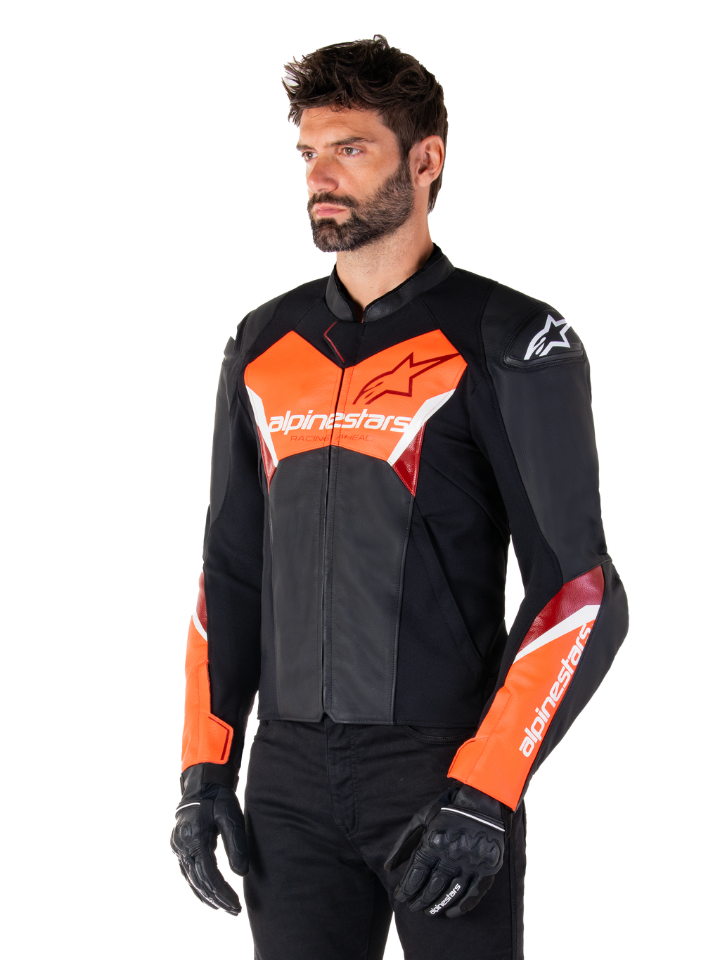 Alpinestars Faster V3 læderjakke, sort og fluorød, premium sportsjakke med hvide og røde detaljer, Alpinestars-branding på bryst og ærmer, båret med sorte motorcykelhandsker og bukser.