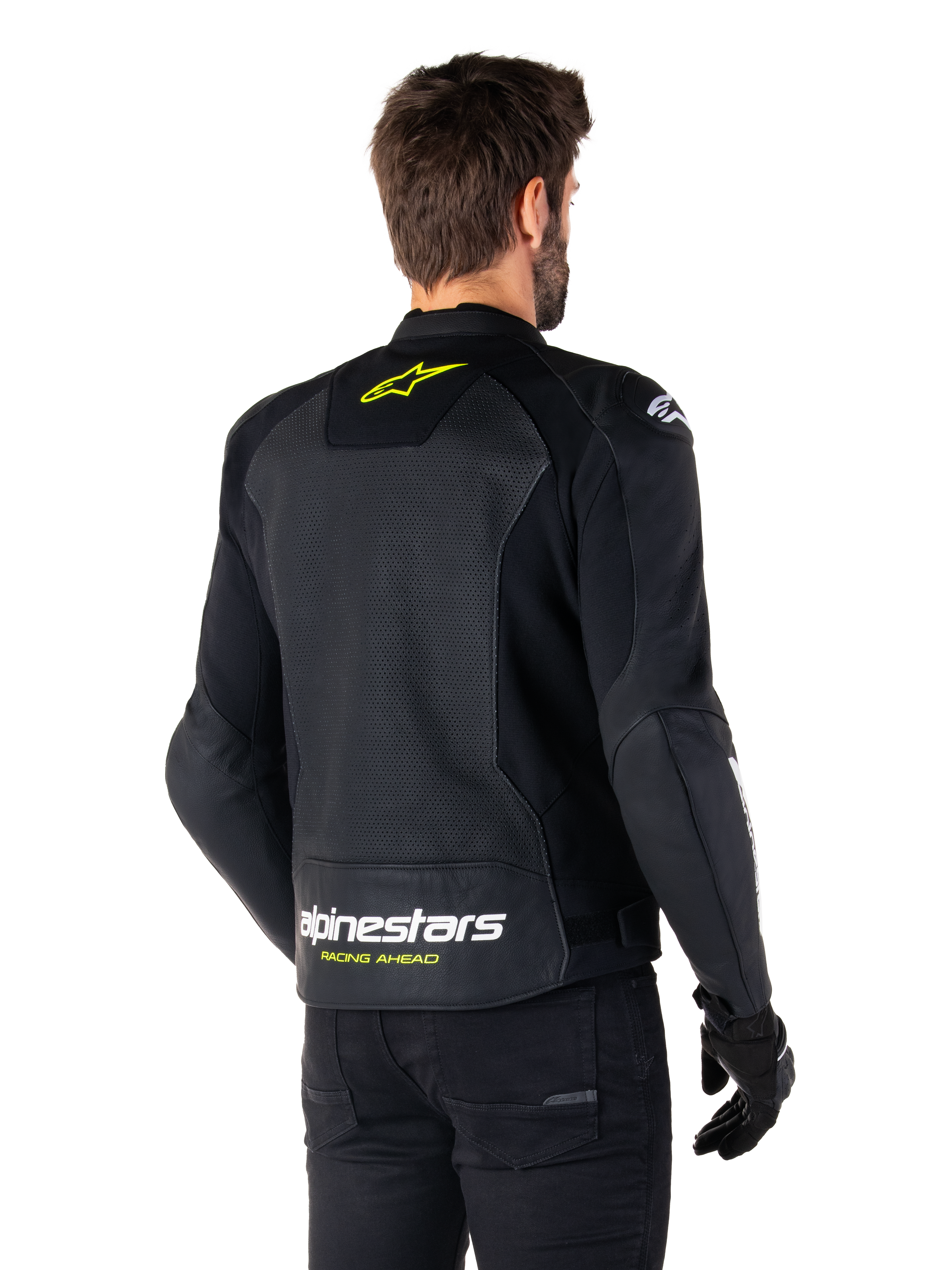 Alpinestars Faster V3 Airflow læderjakke, sort, hvid og gul fluo, set bagfra, med et stort perforeret læderrygpanel til ventilation, gult stjernelogo på kraven og hvidt Alpinestars-logo med gul 'Racing Ahead'-tekst på den nederste kant, sport motorcykelkøreudstyr