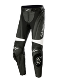 Alpinestars Stella Missile V3 læderbukser, motorcykel-racingbukser til damer, sort og hvid, med harmonika-strækpaneler over knæene, integrerede knæ-sliders med Alpinestars-logo, hvide accentbånd og en strømlinet pasform til sports- og banekørsel.