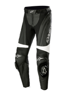 Alpinestars Stella Missile V3 læderbukser, motorcykel-racingbukser til damer, sort og hvid, med harmonika-strækpaneler over knæene, integrerede knæ-sliders med Alpinestars-logo, hvide accentbånd og en strømlinet pasform til sports- og banekørsel.