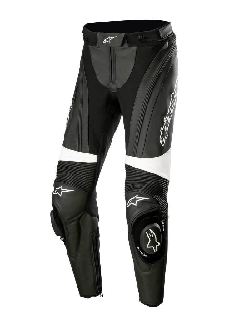 Alpinestars Stella Missile V3 læderbukser, motorcykel-racingbukser til damer, sort og hvid, med harmonika-strækpaneler over knæene, integrerede knæ-sliders med Alpinestars-logo, hvide accentbånd og en strømlinet pasform til sports- og banekørsel.