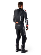 Alpinestars GP-R7 1-stk læderdragt, herreracerdragt i sort og rød fluo med aerodynamisk pukkel og Tech-Air Ready-logo.