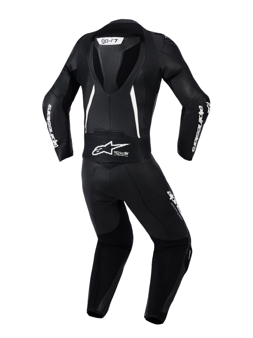 Alpinestars Stella GP-R7 2-delt læderdragt til kvinder, set bagfra i sort med hvide detaljer, integreret aerodynamisk pukkel, harmonika-strækpaneler på skuldre og lænden, perforeret læder til ventilation, tydelig Alpinestars-branding.