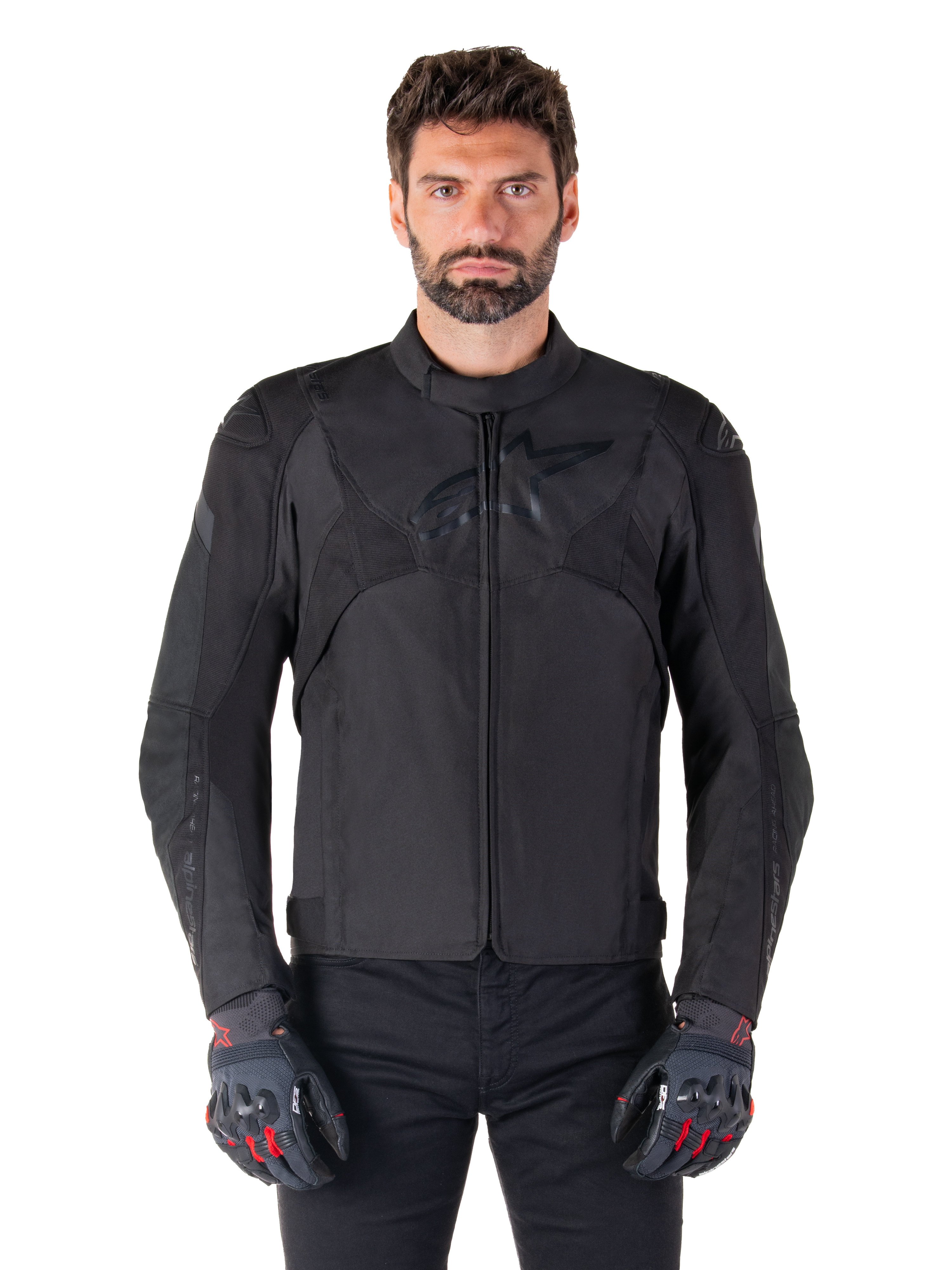 Alpinestars T-Jaws V4 Waterproof Jacket, Black Motorcycle Sport Jacket, worn by a man with black gloves featuring red accents, reinforced shoulders and arms, sleek design with subtle chest logo, textile all-weather riding gear