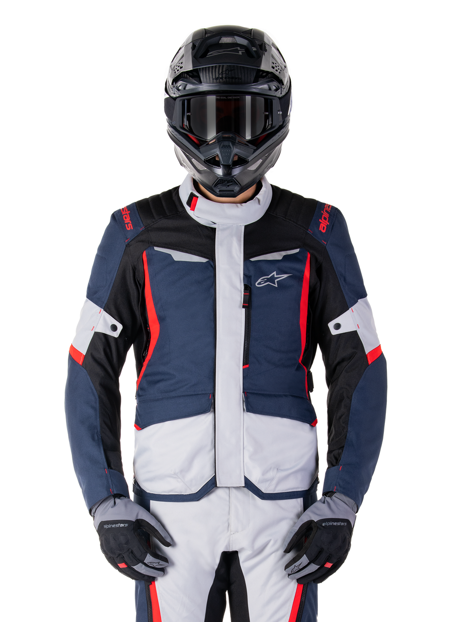 Alpinestars ST-1 Waterproof Jacket, motorcykeljakke til touring, unisex, blå med røde og hvide detaljer, vandtæt konstruktion, beskyttende design med logo på brystet, vist med matchende bukser og sort hjelm
