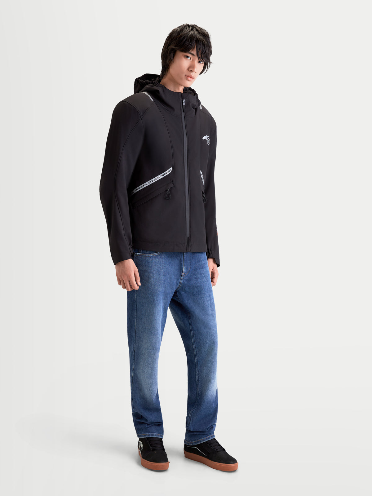 Alpinestars C-5 Drystar Jacket, men's urban contemporary motorcycle textile jacket in black, worn by a model, featuring waterproof softshell construction, integrated hood, and reflective detailing.