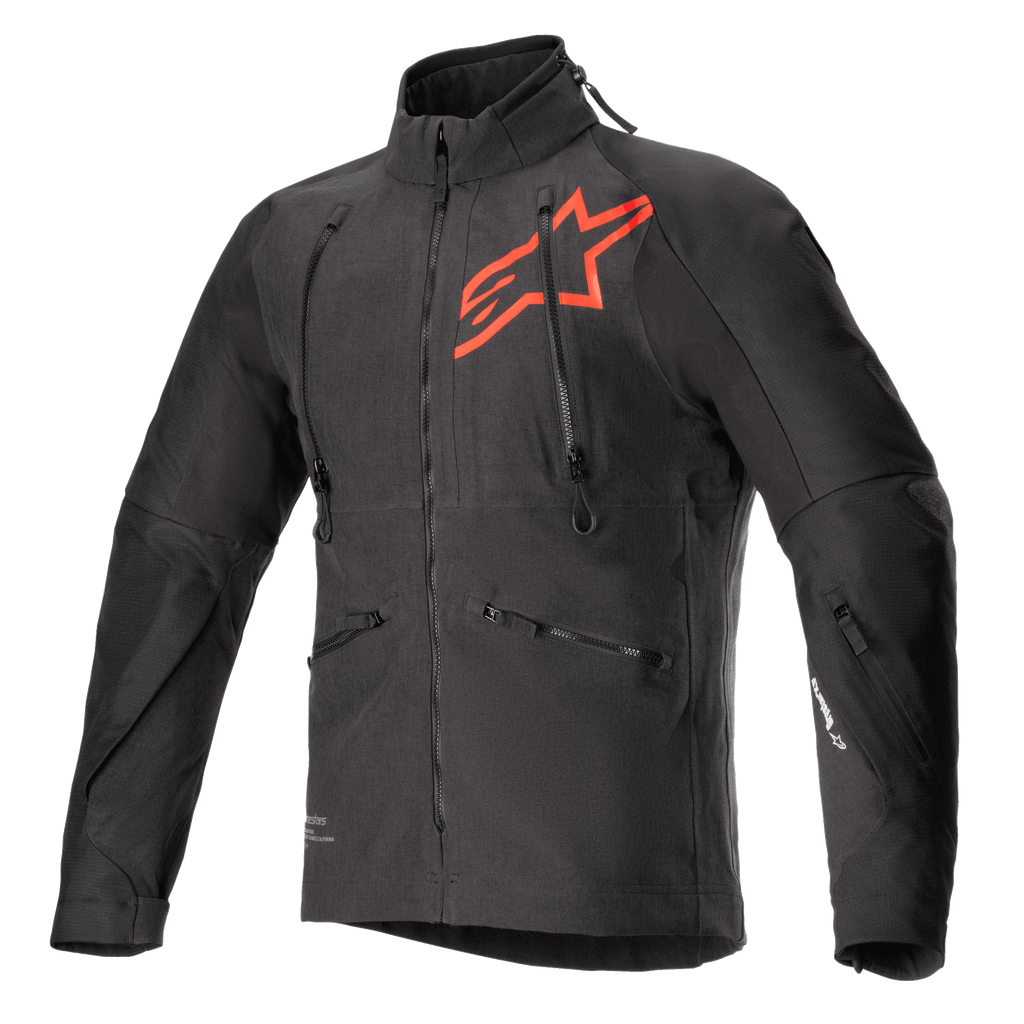 Alpinestars Hyde XT Drystar XF-jakke, sort og rød teknisk motorcykeljakke, stort rødt stjerne-logo på brystet, lodrette ventilationslynlåse på brystet, høj krave, tekstureret firevejs-strækstof, designet til adventure- og off-road-kørsel