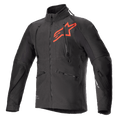 Alpinestars Hyde XT Drystar XF-jakke, sort og rød teknisk motorcykeljakke, stort rødt stjerne-logo på brystet, lodrette ventilationslynlåse på brystet, høj krave, tekstureret firevejs-strækstof, designet til adventure- og off-road-kørsel