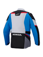 Alpinestars Honda ST-1 vandtæt jakke, set bagfra, blå og lysegrå med sorte paneler og røde detaljer, har et stort hvidt HONDA-logo på den nederste cargolomme, tekstiljakke i adventure touring-stil