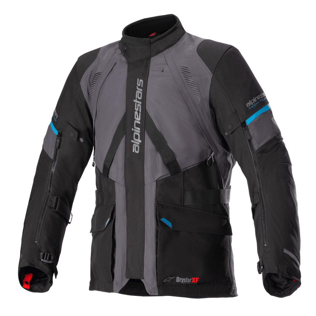Alpinestars Monteira Drystar XF jakke, adventure touring-motorcykeljakke, grå og sort med Methyl Blue-detaljer, med flere frontlommer, justerbare taljestropper og lodret Alpinestars-branding på brystet, slidstærk vandtæt tekstilkonstruktion