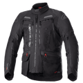 Alpinestars Bogota Pro Drystar jakke, helsort motorcykel touringjakke, grå og røde detaljer, store ventilationspaneler på brystet, vandtætte lommer med røde snoretræk, høj beskyttende krave, slidstærk tekstilkonstruktion til adventure-kørsel