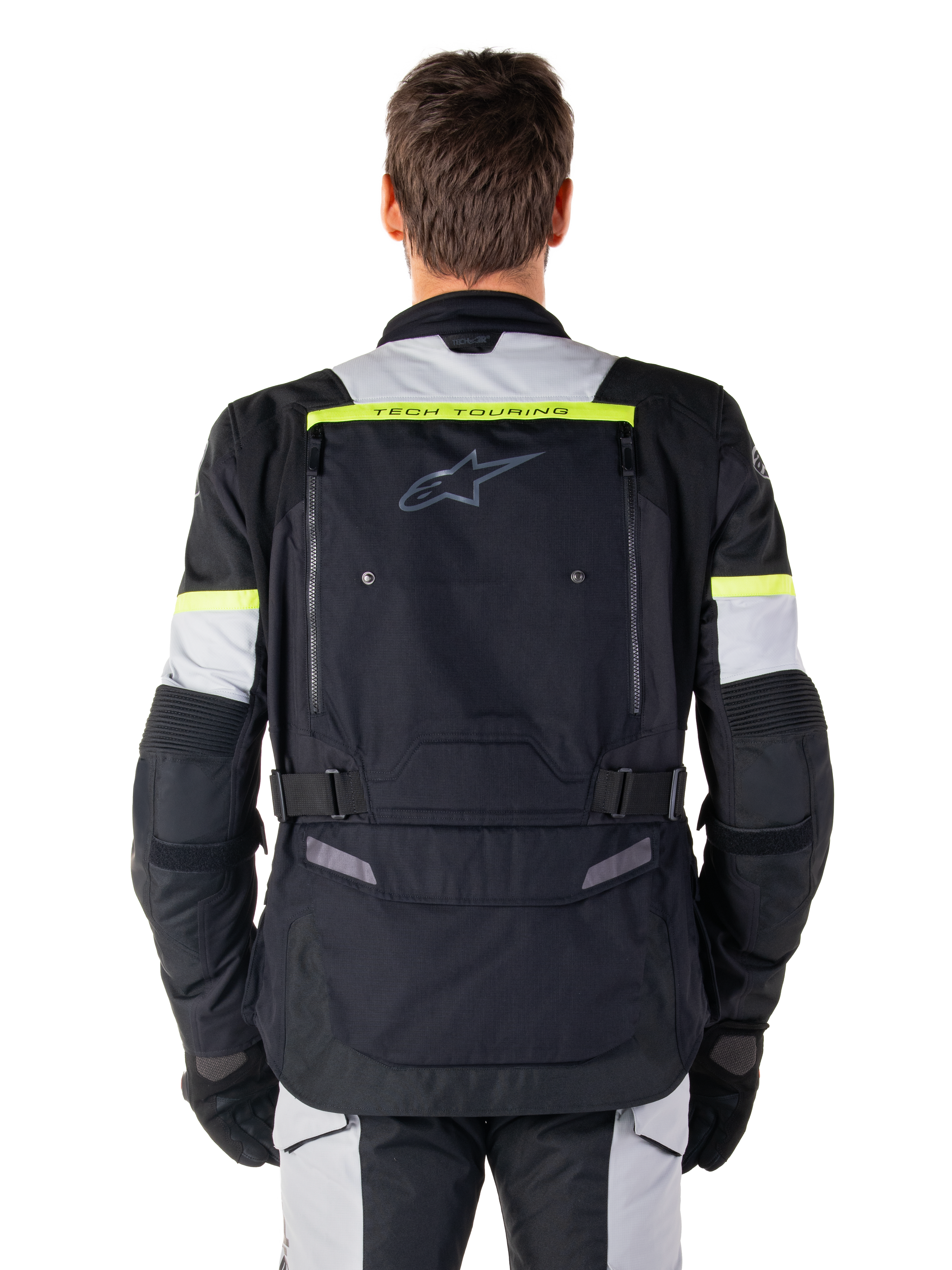 Alpinestars Bogotá Pro Drystar®-jakke, adventure touring motorcykeljakke, sort, isgrå og neongul, set bagfra med 'TECH TOURING'-branding på en neongul stribe, stort ventilationspanel på ryggen og justerbare taljeremme, teknisk helårsudstyr