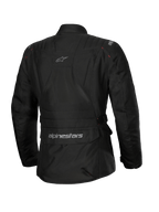Alpinestars Stella ST-1 Vandtæt jakke, motorcykeljakke til kvinder, sort, set bagfra med en stor cargolomme på lænden med logo, adventure touring-design med diskret branding på den øverste ryg, holdbar vandtæt tekstilkonstruktion.
