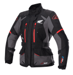 Alpinestars Stella Honda Andes V3 Drystar damejakke, motorcykel touringjakke, sort og grå med klare røde detaljer, Honda-vingelogo på brystet, røde lynlåse, justerbare stropper i taljen og på armene, holdbar vandtæt konstruktion