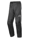 Alpinestars Hurricane Rain V2 Pant, Waterproof Motorcycle Rain Pants, Black, featuring reflective branding on the left thigh, elasticated waistband, ergonomic knee design, and shiny wind-resistant laminated fabric for road and adventure touring