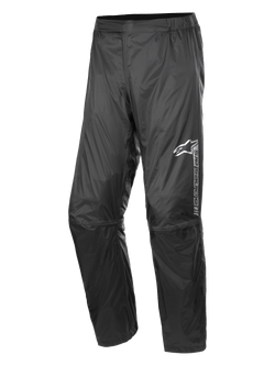 Alpinestars Hurricane Rain V2 Pant, Waterproof Motorcycle Rain Pants, Black, featuring reflective branding on the left thigh, elasticated waistband, ergonomic knee design, and shiny wind-resistant laminated fabric for road and adventure touring