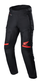 Honda Bogota' Pro Drystar® Pants, Motorcycle Touring Pants, Black and Red, featuring red Honda Wing logo on the thigh, accordion stretch panels at the knees, technical textile construction, adjustable waist straps, and Alpinestars branding