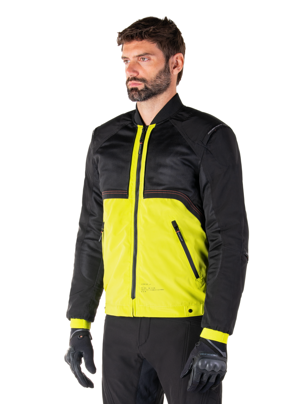 Alpinestars Mootant vandtæt parka i Lime Punch Black, modulær motorcykeljakke med sort mesh-overdel og livlig limegrøn underdel, båret af en mandlig kører med sorte handsker og bukser, moderne urban kørestil
