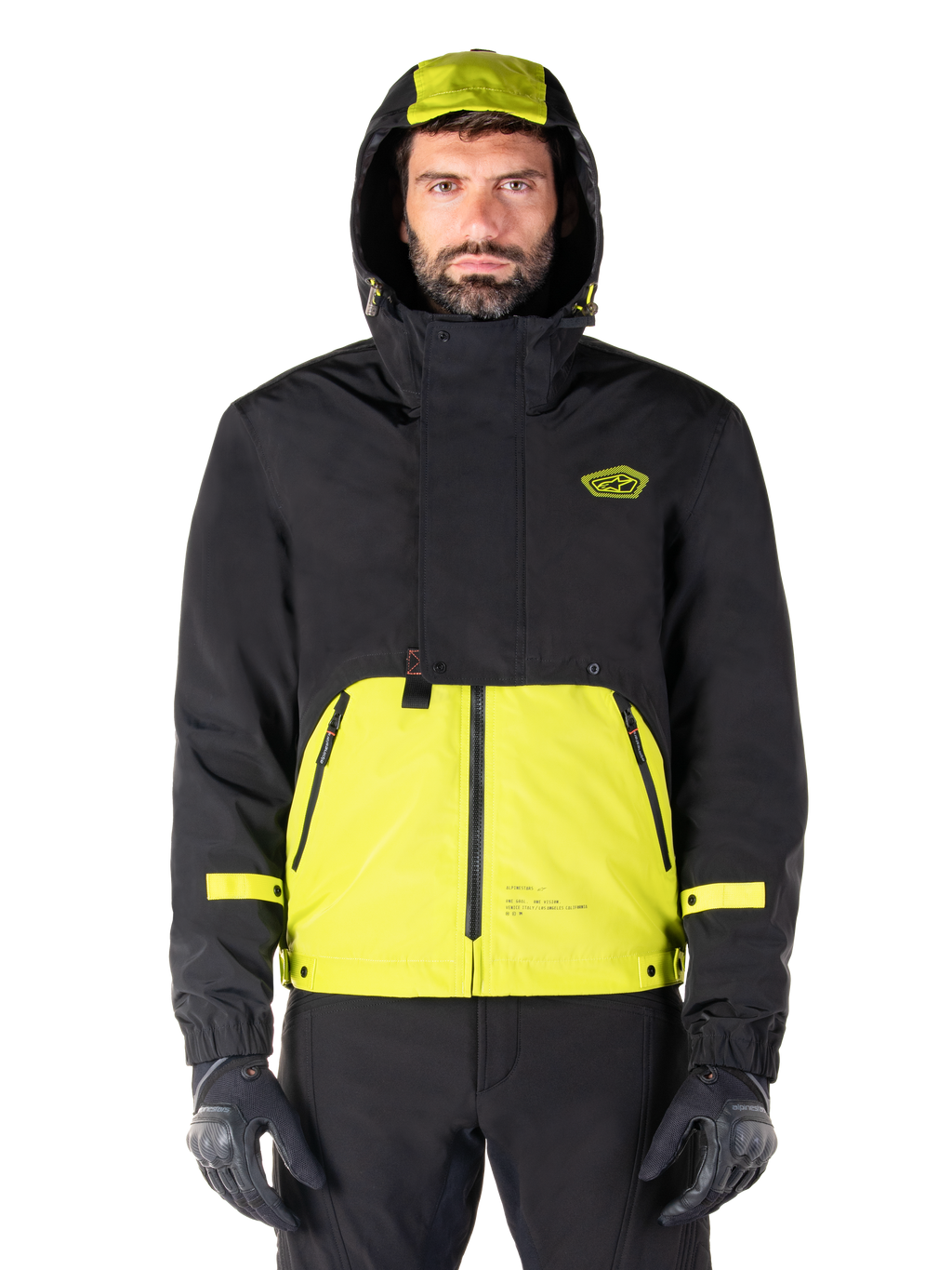 Alpinestars Mootant Vandtæt Parka, Lime Punch Black motorcykeljakke, set forfra, modulært 3-i-1-design med sort overdel og klar limegrøn underdel, med hætte med snoretræk og brystlogo, bæres med sorte bukser og kørehandsker