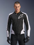 Alpinestars Viper Air V4 Jacket, Motorcycle Racing Jacket, Black and White, worn by rider, tech mesh and textile construction with white shoulder panels, prominent star logo on chest, sport performance design, paired with black riding gloves