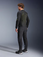 Alpinestars Troop-Air Jacket in Black and Yellow Fluo, rear view of a male model wearing the technical air jacket, featuring a large mesh back panel with yellow highlights and fluo yellow Alpinestars logos, paired with black motorcycle pants.