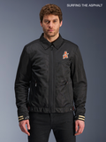Alpinestars Ignite Air Jacket, men's urban motorcycle textile jacket in black, front view worn by a model featuring a traditional shirt collar, club-inspired chest graphics, and CE certified construction.