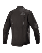 Alpinestars Venture XT-jakke, sort, set bagfra, adventure touring-motorcykeljakke i tekstil, ASTARS-branding på skulderen, lodrette ventilationslynlåse på ryggen, PU-filmforstærkninger på ærmerne
