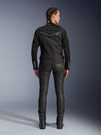 Alpinestars Stella T-Dyno Air Jacket, Rear view, Black woman's motorcycle jacket with white piping and small star logo, worn with black technical pants and riding boots, sleek biker fit for urban road riding