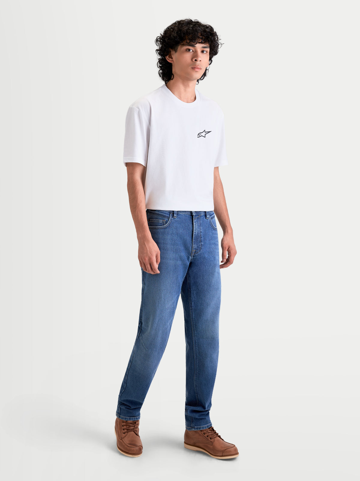 Alpinestars Flex-AST 7 Denim Pants, men's urban riding denim pants in light blue, front full-length view on a model wearing a white t-shirt and brown shoes, AA certified technical motorcycle jeans