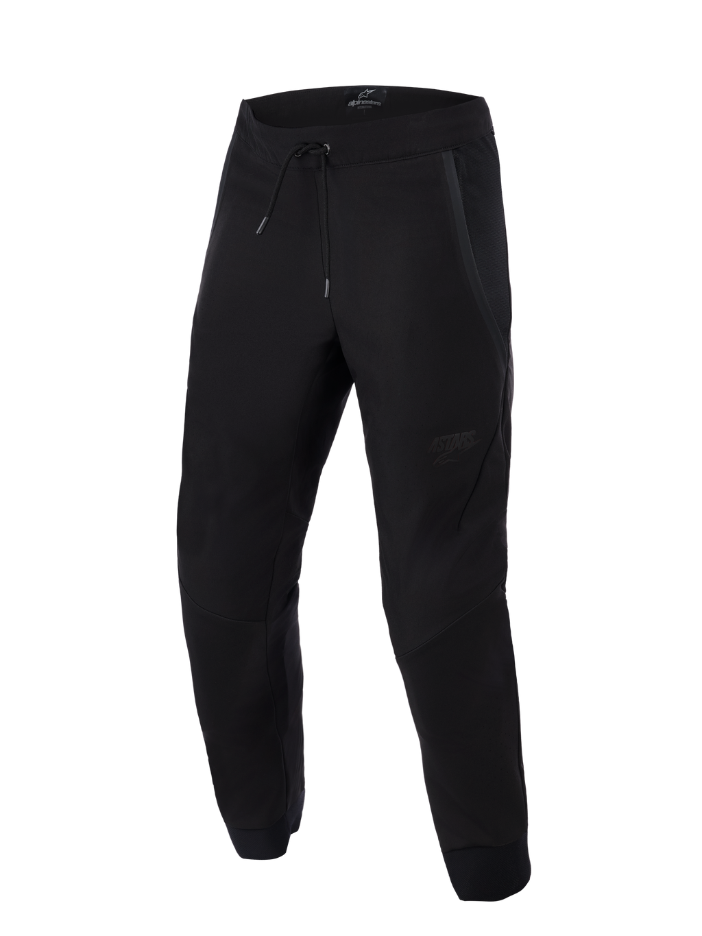 Alpinestars Aeroshell Airflow bukser, sorte, lette sport- og touring motorcykelbukser, med omfattende mesh-paneler til ventilation, elastisk talje med snoretræk, forbøjede ben og diskret tonalt logo på låret.