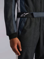 Alpinestars GP Pro Comp V2 FIA Auto Racing Suit, Black and Asphalt with embroidered star logo belt and ribbed wrist cuff.