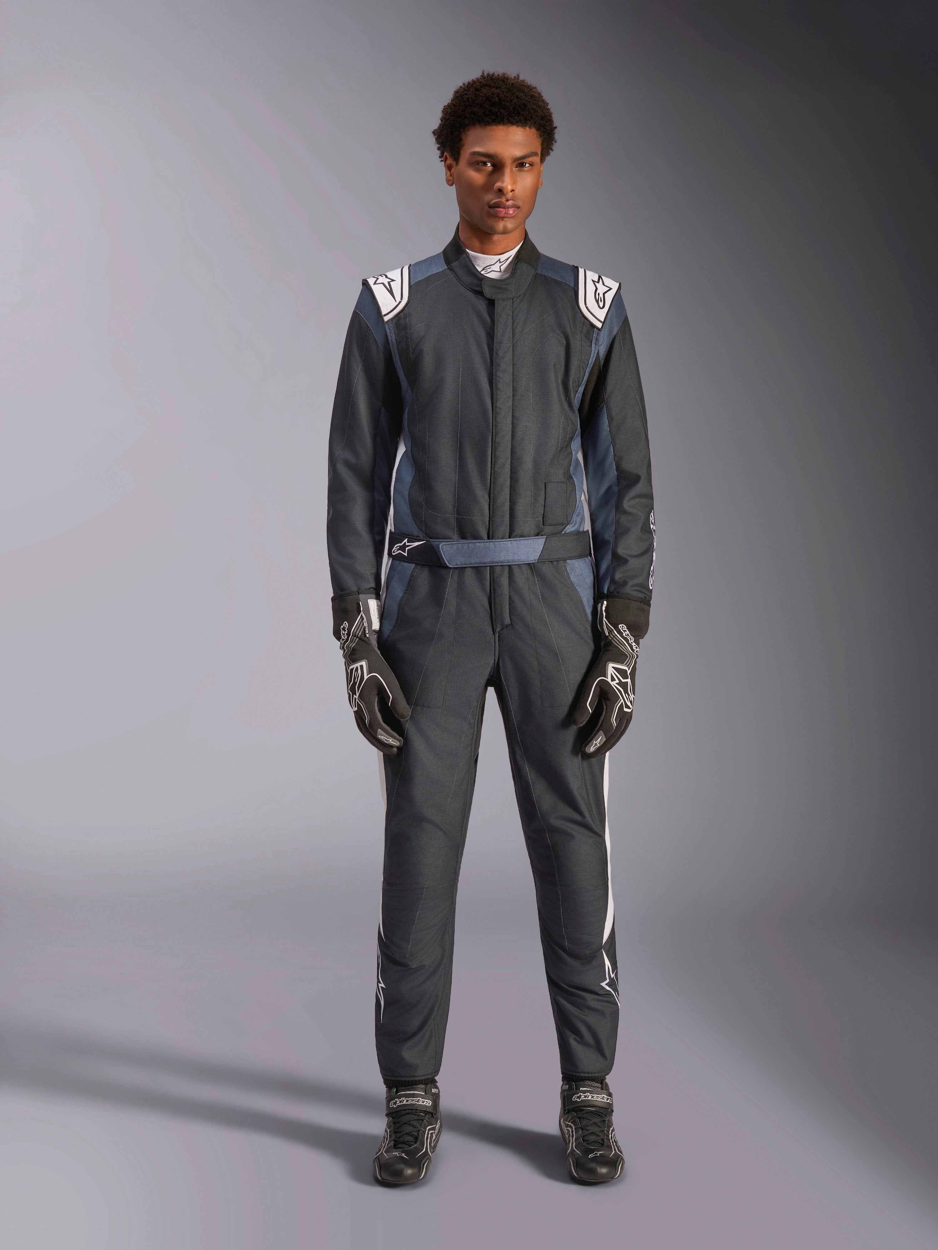 Alpinestars GP Pro Comp V2 FIA Suit is a professional men's auto racing suit in black and white for circuit driving.