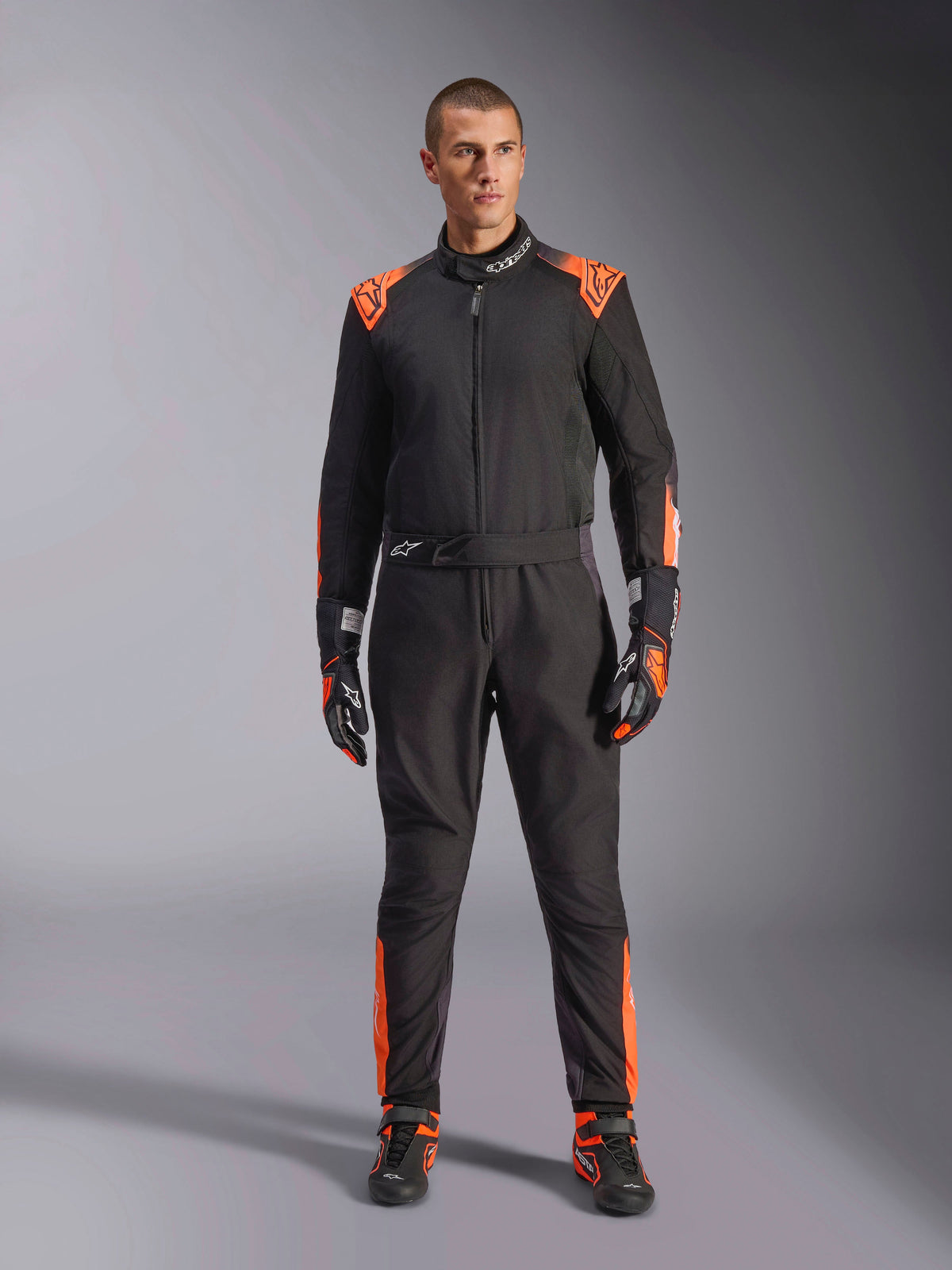 Alpinestars KMX-5 V3 kartingkøredragt til herrer, sort og orange fluo, FIA 8877-2022 Grade 1-certificeret racerudstyr.
