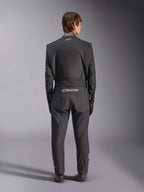 Alpinestars GP Tech V4 Suit, Auto Racing Suit, Black and White, back view featuring white Alpinestars branding and FIA certification on the collar, sleek ergonomic fit for professional driver protection