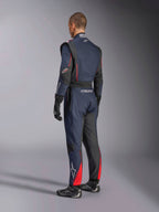 Alpinestars GP Tech V4 Suit, Blue Navy Black Red, back side view of professional one-piece auto racing suit, featuring red accents and black panels, worn with black racing gloves and shoes, FIA certified motorsport gear.
