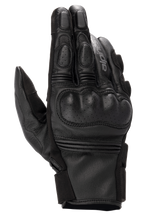 Alpinestars Phenom Leather Gloves, Motorcycle Riding Gloves, Black, top view showing perforated hard knuckle protection, reinforced fingers, accordion stretch inserts, and premium goat leather construction.