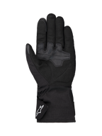 Alpinestars Wt-1 Drystar® forede handsker, motorcykelhandsker, sort, set fra håndfladen med forstærkede tekstilgrebområder, lang manchet med hvidt Alpinestars-logo på stroppen, vejrbestandig konstruktion til landevejskørsel