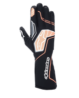 Alpinestars Tech-1 KX V4 handsker, kartinghandsker, sort og fluorescerende orange, viser åndbar mesh-konstruktion, orange og hvide grafiske detaljer, Alpinestars-logo på knoerne og manchetten, professionelt racerdesign