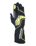 Alpinestars Tech-1 KX V4 handsker, karting racinghandsker, Tar Gray, sort og fluorescerende gul, set fra håndryggen med åndbar mesh-konstruktion, stort gult Alpinestars-logo, hvidt navnetræk på håndleddet, gul stjerne på pegefingeren, moderne sportsligt design