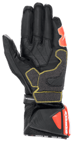 Alpinestars GP Tech V2 handsker, sort, hvid og rød fluo, set fra håndfladen med sort læderkonstruktion og gule kontrastsyninger, beskyttende DFS-manchet med røde detaljer, professionelt racing-motorcykeludstyr