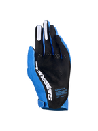 Alpinestars Supertech MX handsker, motocrosshandsker, Ucla Blue og Deep Blue med hvide detaljer, håndfladevisning der viser sort perforeret materiale, hvidt Alpinestars-logo, silikone-fingergreb og teknisk tekst, professionelt off-road racingudstyr
