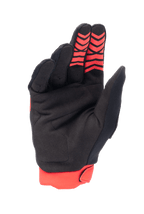 Alpinestars Honda Full Bore handsker, motocrosshandsker, lys rød og sort, håndfladevisning med syntetisk ruskindsmateriale og røde silikone-grebsmønstre på fingerspidserne, rød strækmuffe, holdbart design til off-road racing