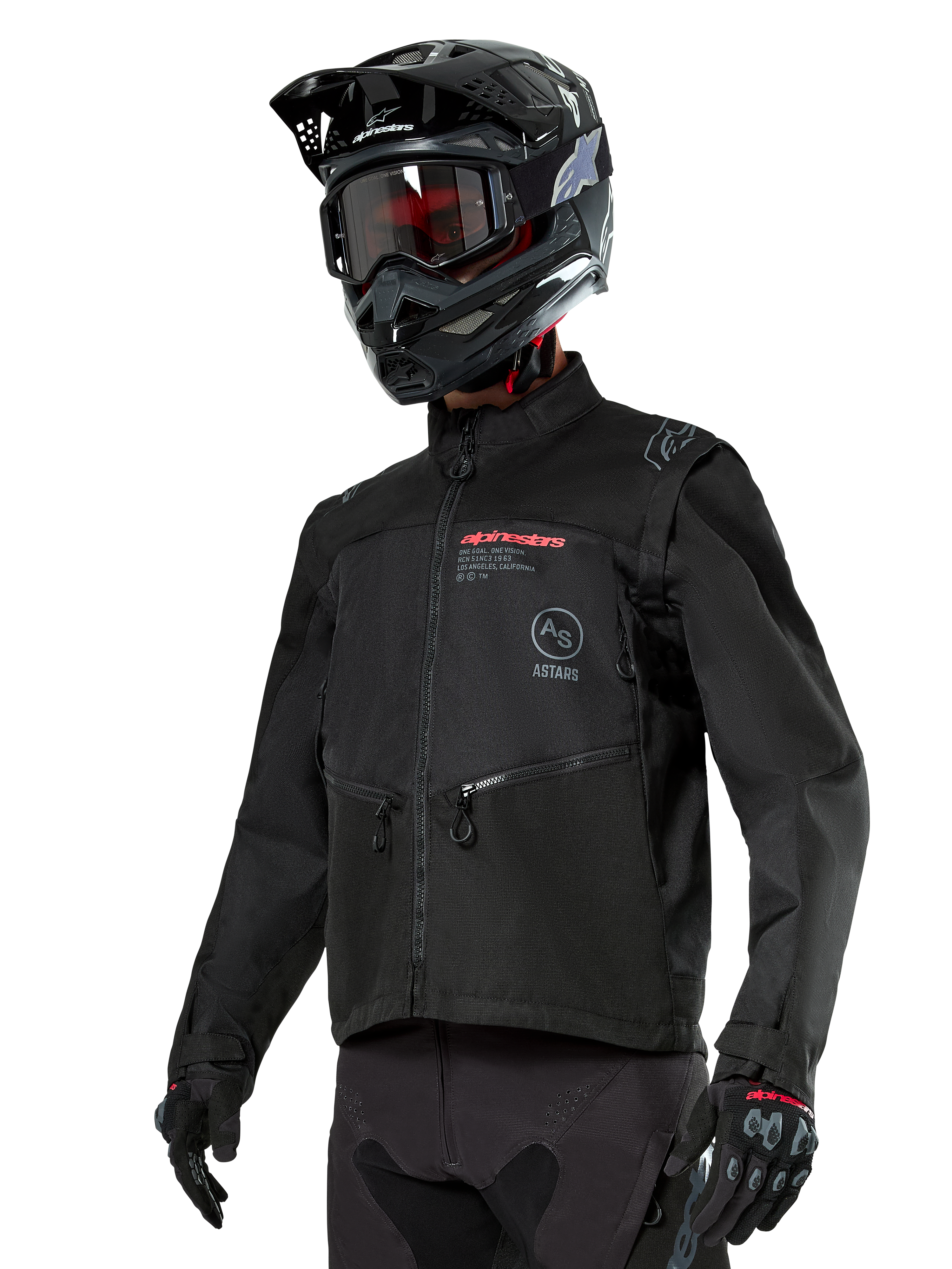Alpinestars Pro-Dura jakke, off-road motorcykeljakke, sort med røde og grå logoer, har forlommer med lynlås og høj krave, bæres med en sort motocrosshjelm og handsker til enduro-løb